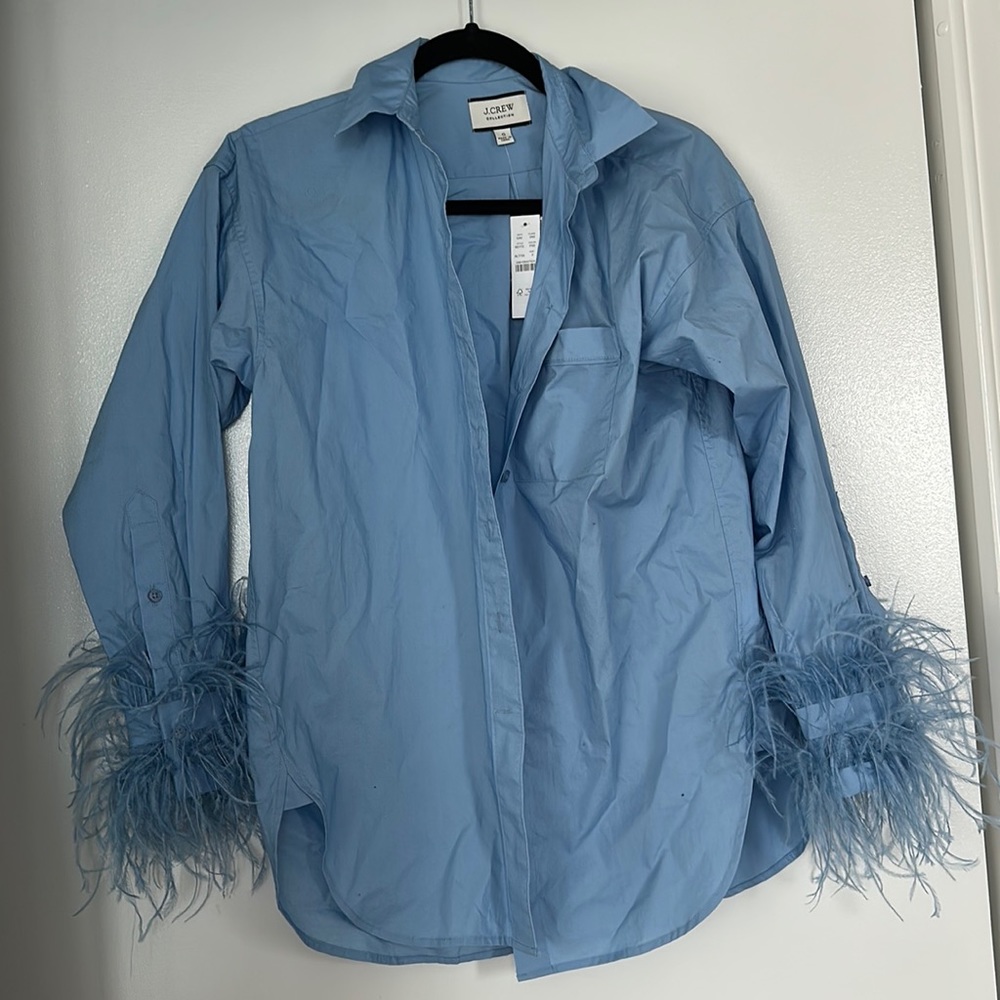Never worn J. Crew Collection feather cuff blue button down shirt.